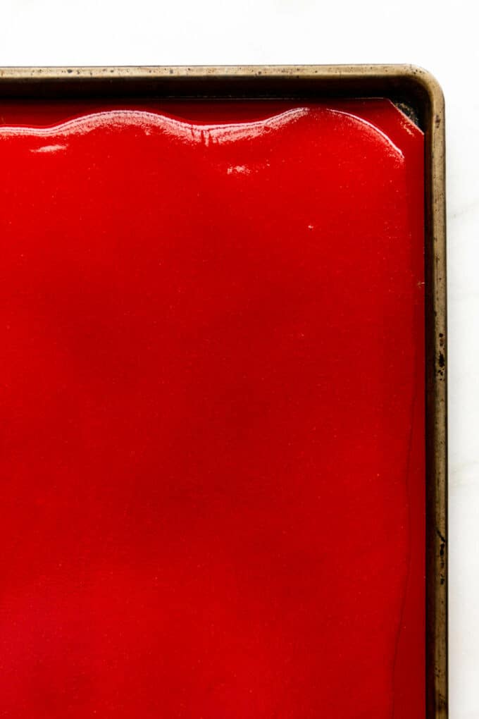 strawberry puree on a baking sheet