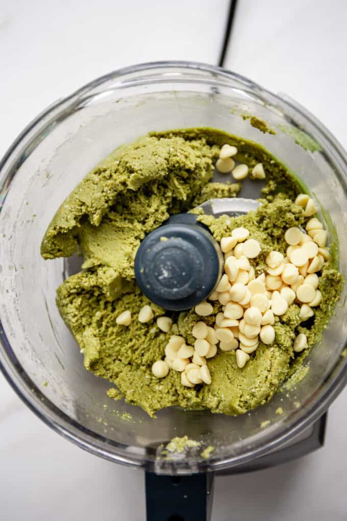 matcha energy balls dough and white chocolate chips in a food processor