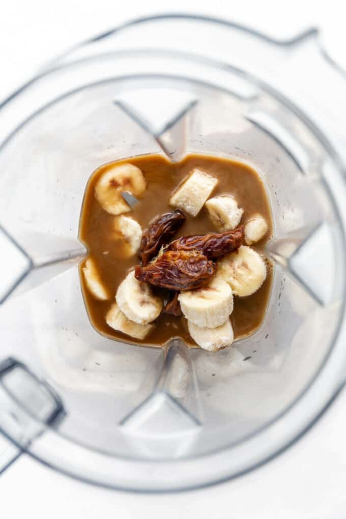 bananas, dates, coffee and almond milk in a blender