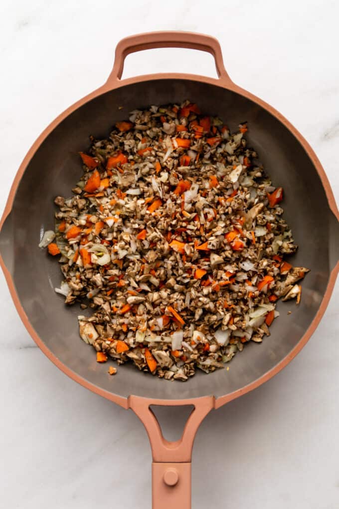 chopped mushrooms, carrots, onion and garlic in a pan
