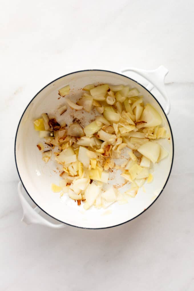 onions, garlic and ginger in a white pot