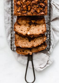 3 slices of cinnamon apple bread on a cooling rack