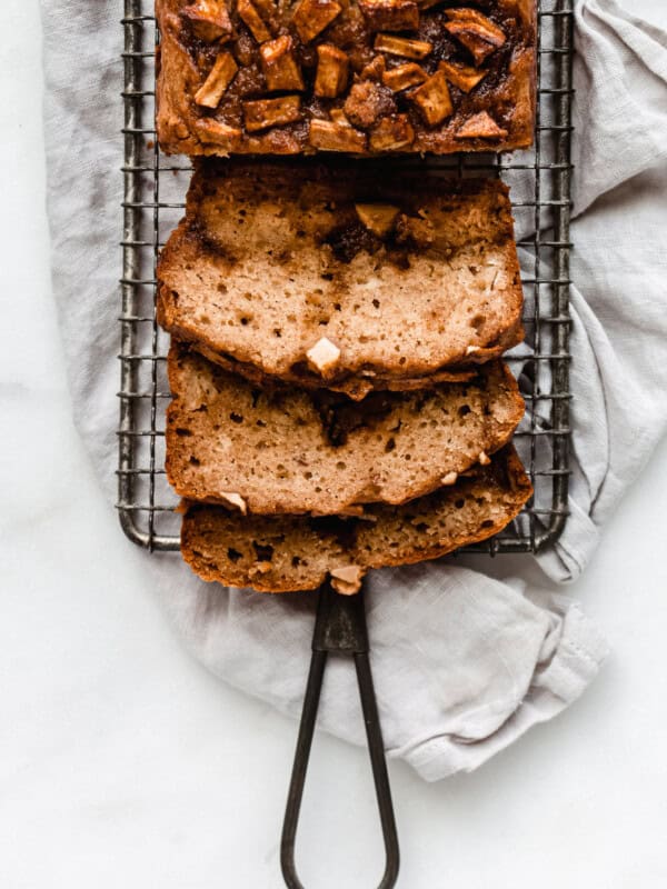3 slices of cinnamon apple bread on a cooling rack