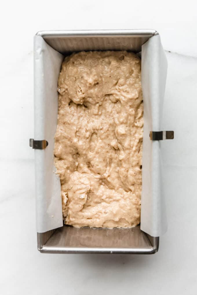 apple bread batter in a loaf pan