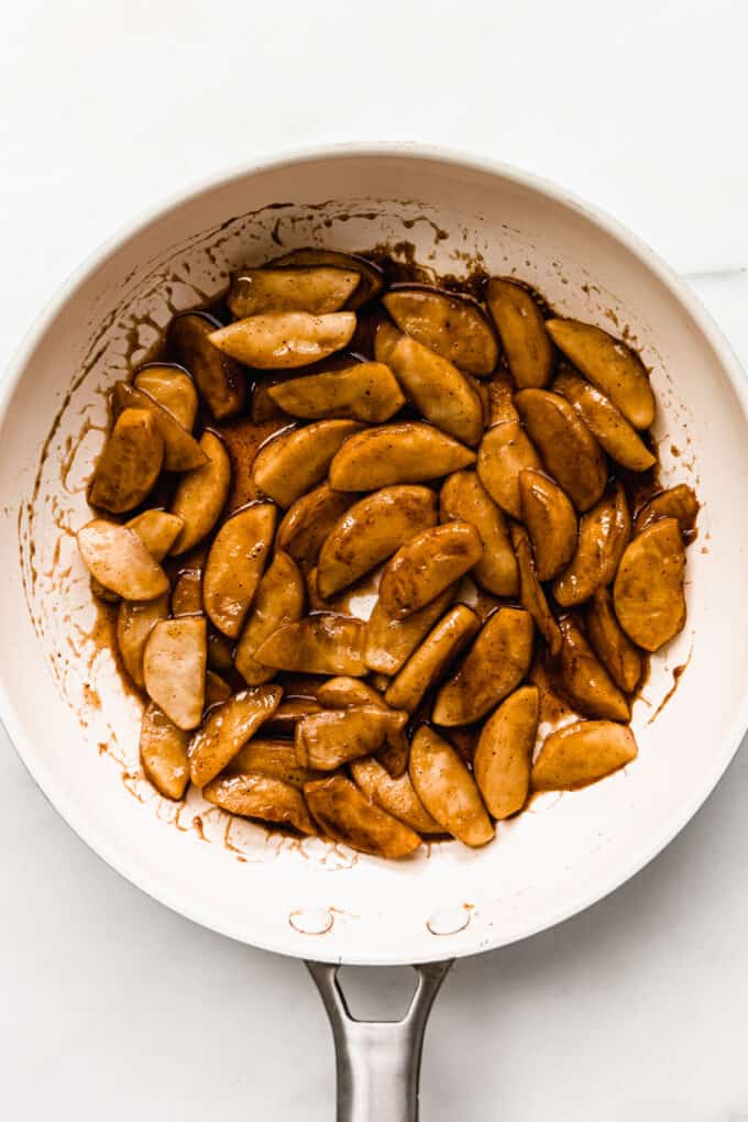 cinnamon apples in a white pan