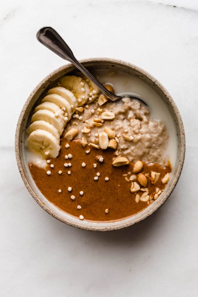 oatmeal in a bowl with peanut butter and bananas