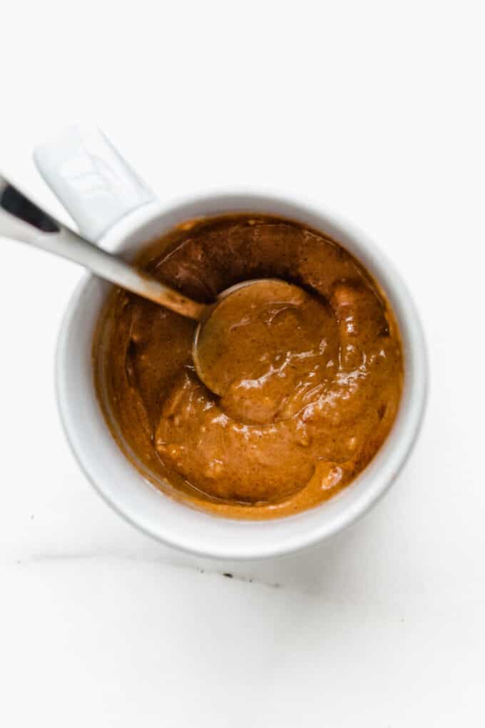 pumpkin mug cake batter in a mug