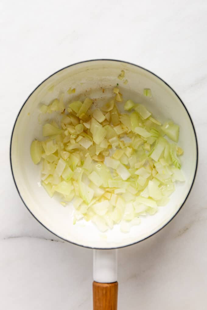 garlic and onions in a white pot