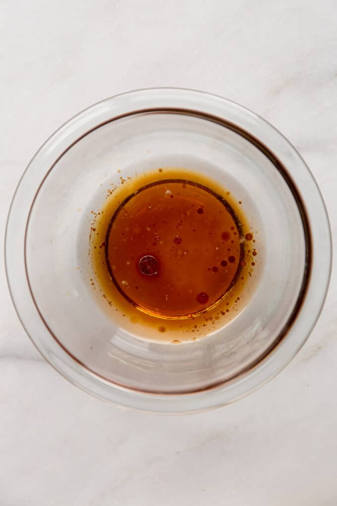 coconut oil, maple syrup and vanilla extract in a clear mixing bowl