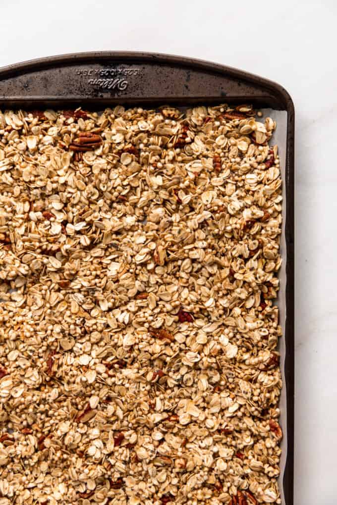 unbaked maple pecan granola on a baking sheet