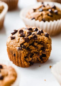 a pumpkin muffin with a bite taken out of it