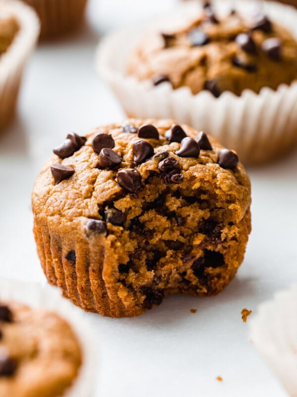 a pumpkin muffin with a bite taken out of it