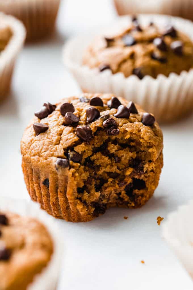a pumpkin muffin with a bite taken out of it