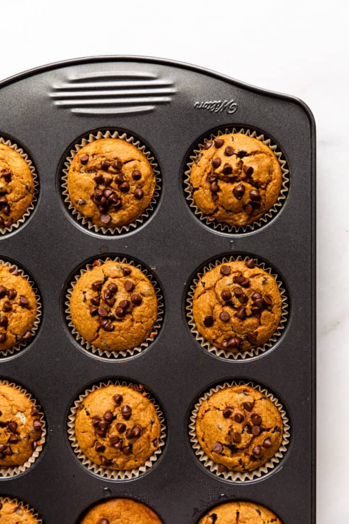 baked pumpkin muffins in a muffin pan