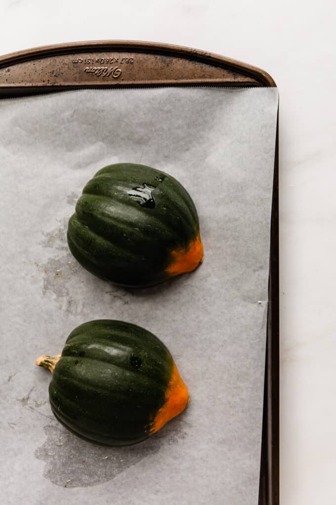 an acorn squash on a baking sheet
