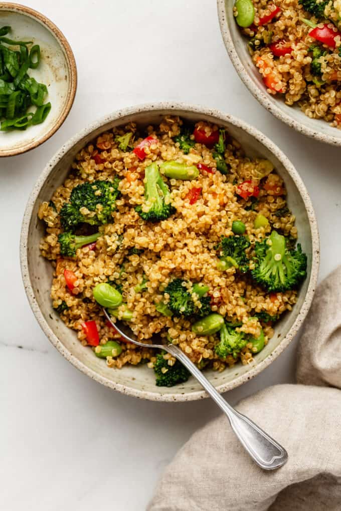 Quinoa fried rice with vegetable in a bowl with a spoon