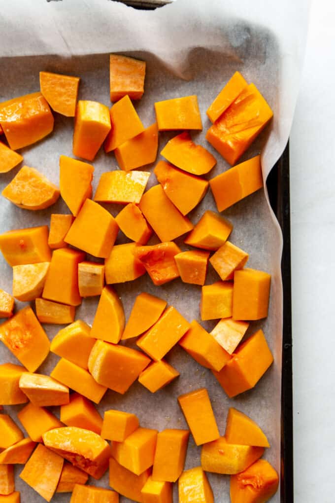 butternut squash and sweet potato on a baking sheet
