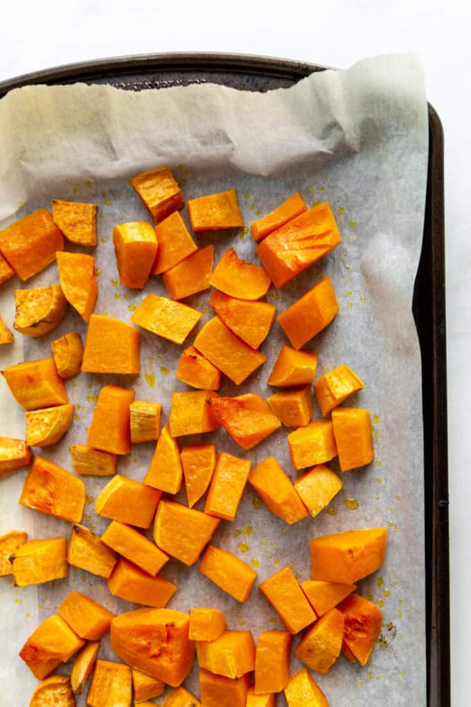 roasted butternut squash and sweet potato on a baking sheet