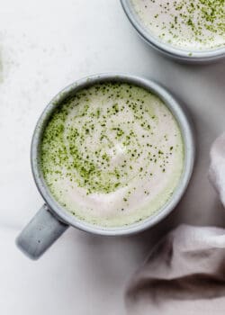 a matcha latte in a blue mug