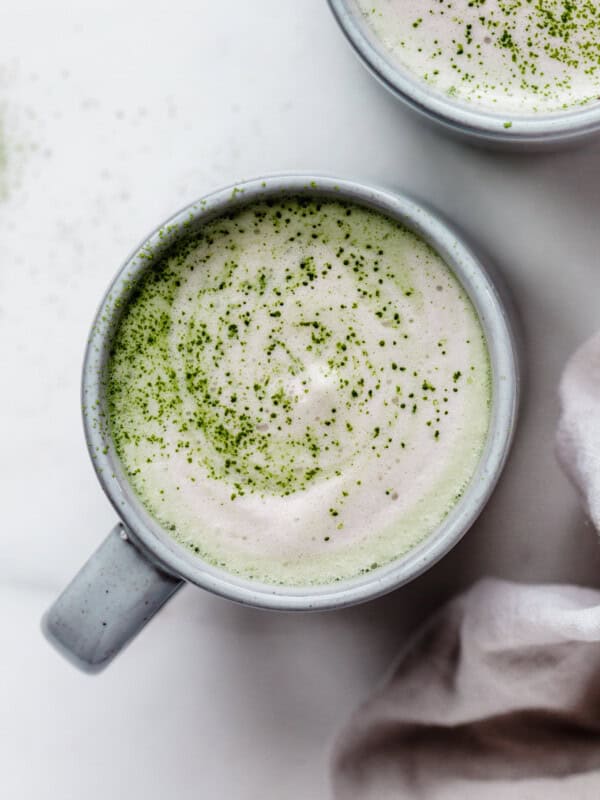 a matcha latte in a blue mug