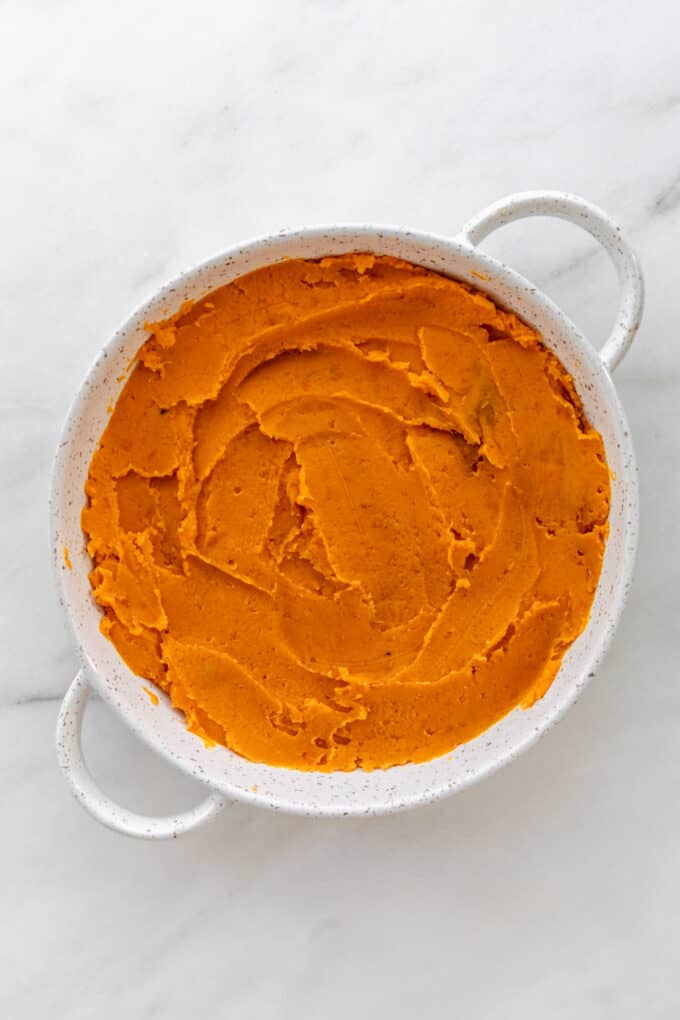 mashed sweet potatoes in a round serving dish