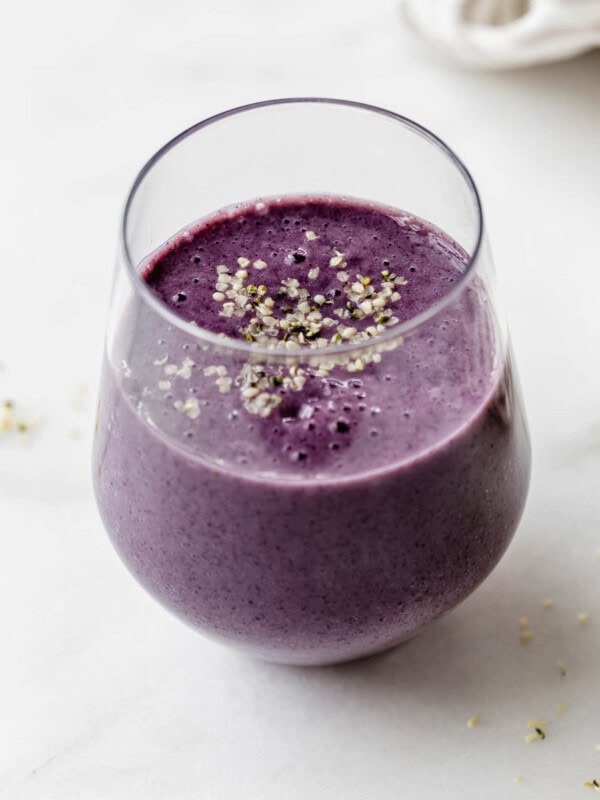 A blueberry avocado smoothie topped with hemp seeds
