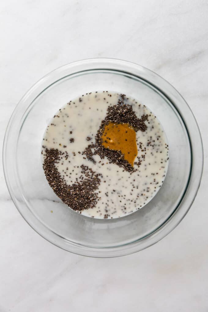 chia seeds, almond milk and peanut butter in a mixing bowl