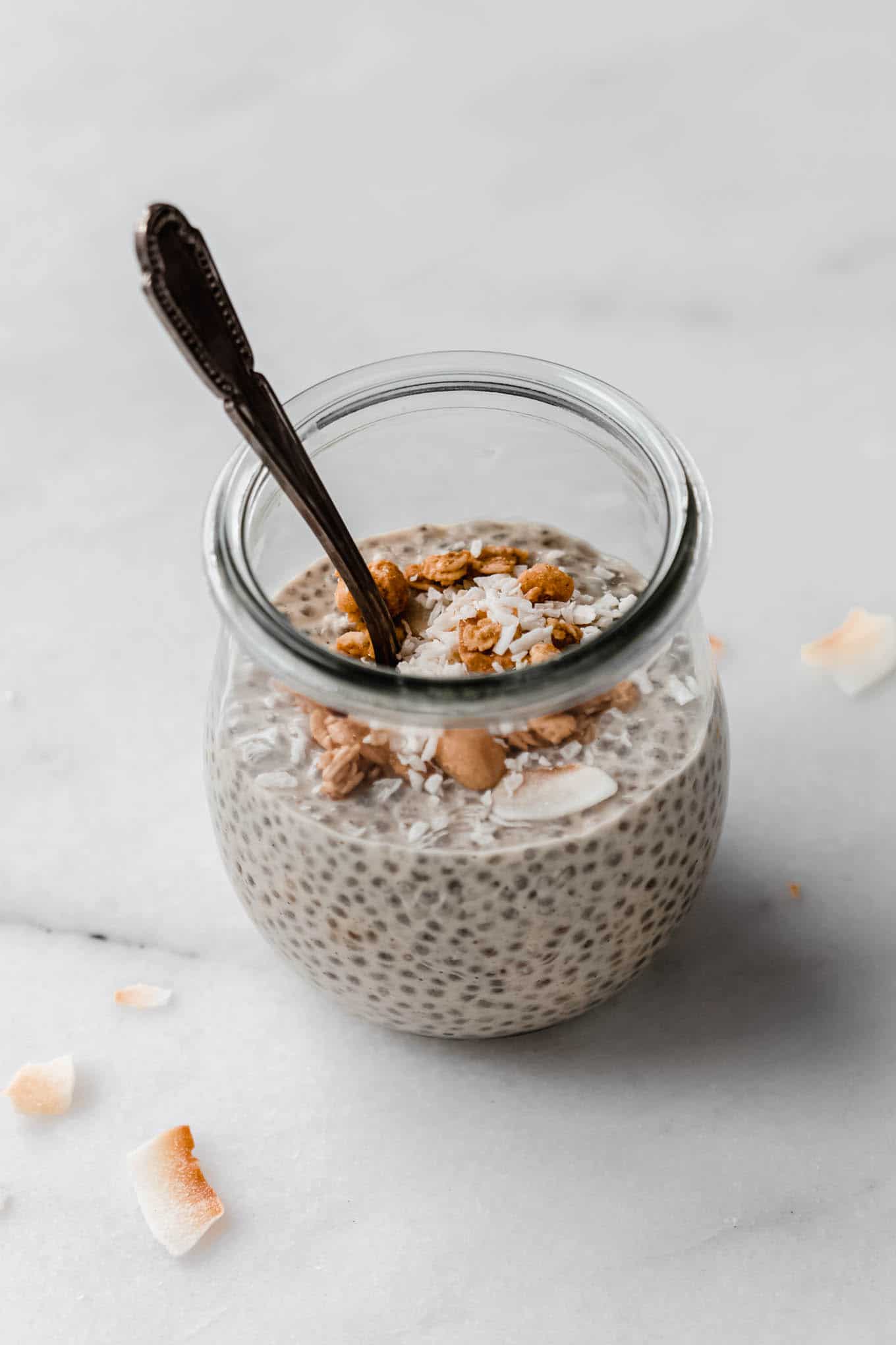 peanut butter chia pudding in a jar with a spoon