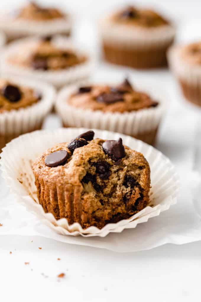 a banana oat flour muffin with a bite taken out of it