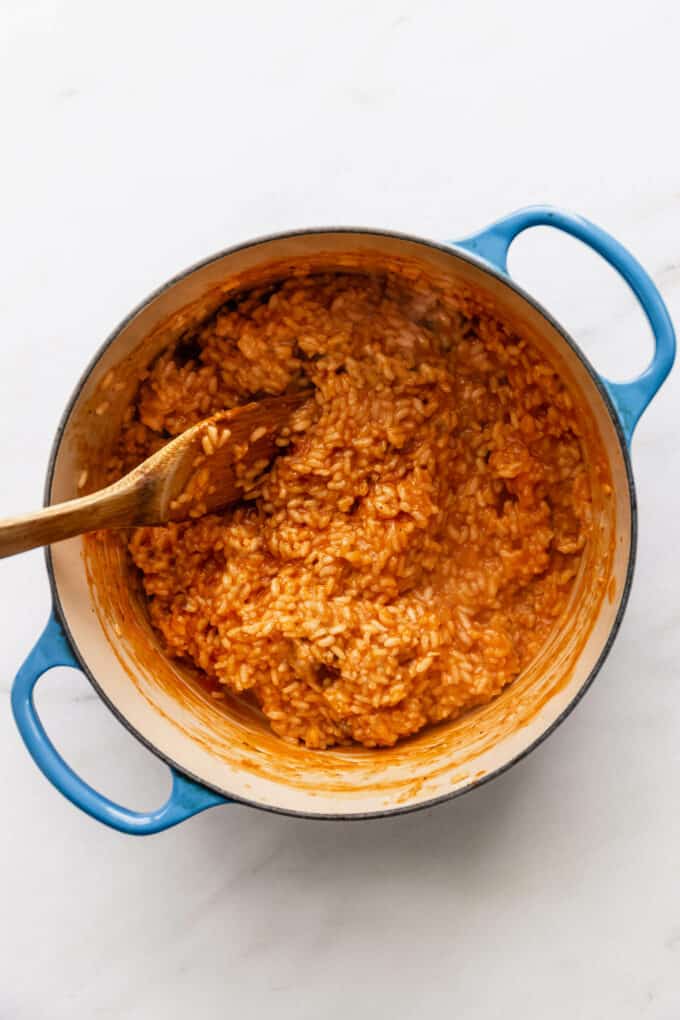 tomato risotto in a blue pot