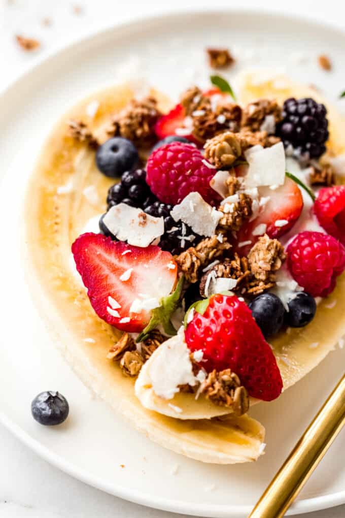 banana and berries with granola and coconut on top