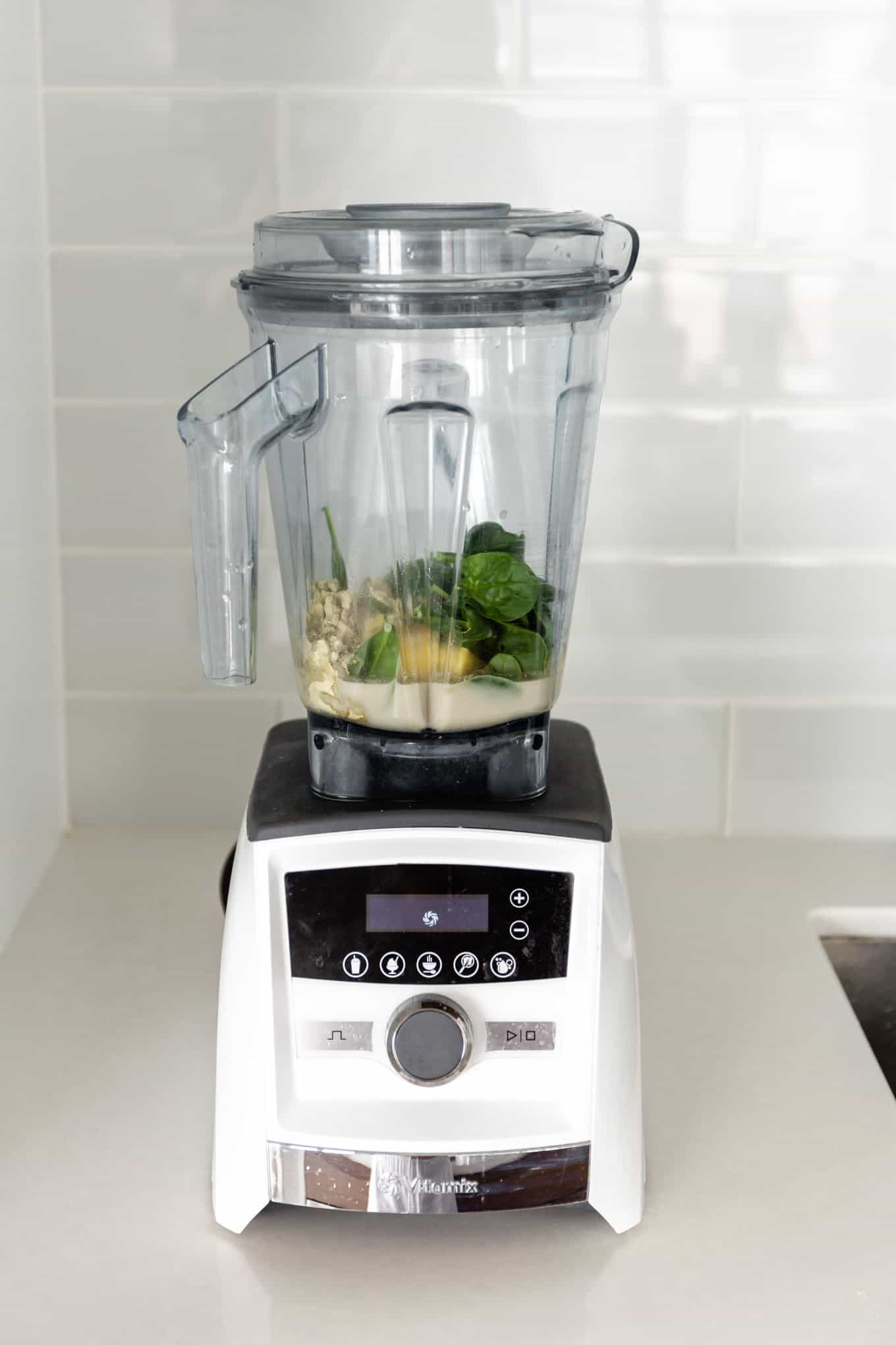 green smoothie ingredients in a blender