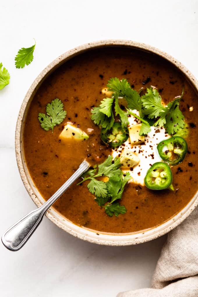 black bean soup topped with cilantro, jalapeños and avocado