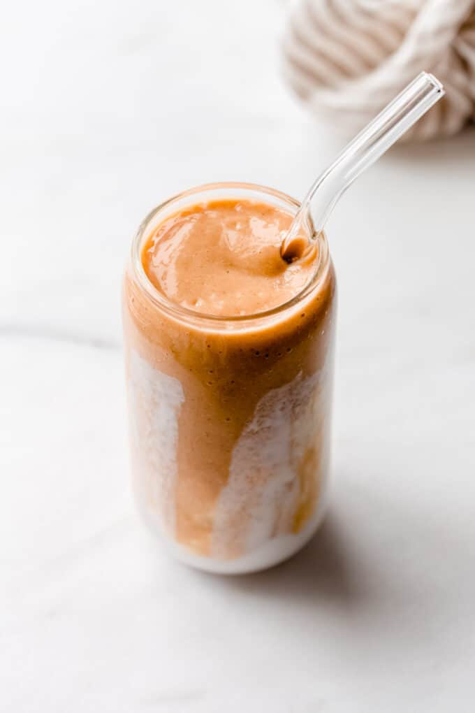 a papaya smoothie on a marble counter