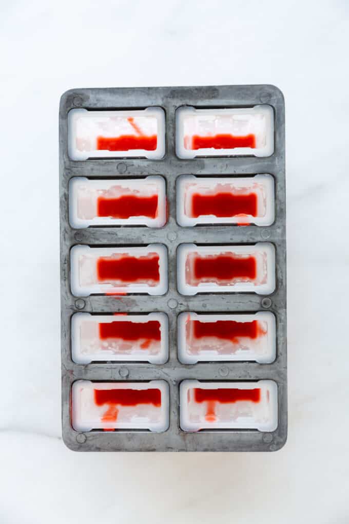 strawberry puree in a popsicle mold