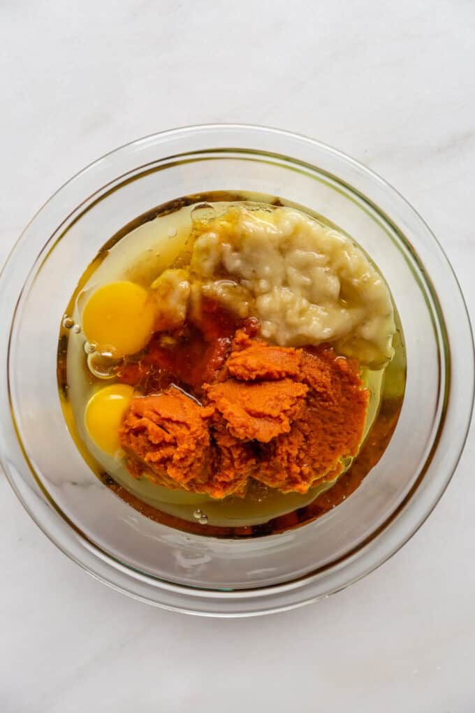 eggs, pumpkin puree, mashed banana and avocado oil in a mixing bowl