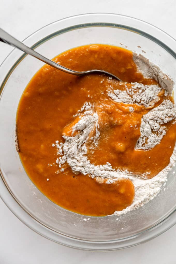 wet and dry ingredients together in a bowl for pumpkin banana bread