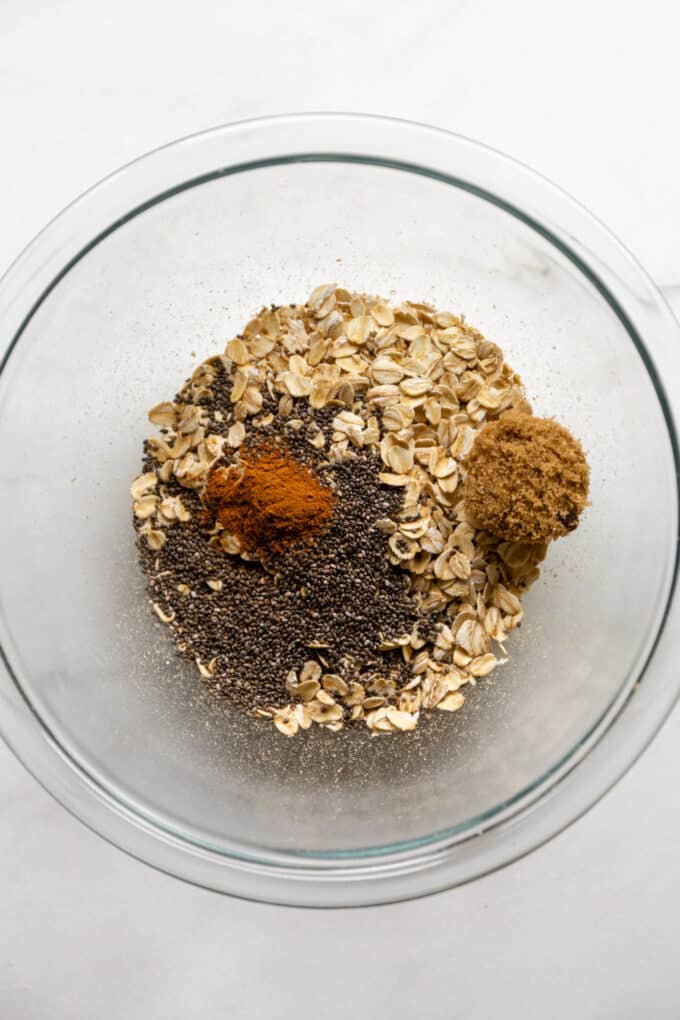 oats, chia seeds, cinnamon and brown sugar in a bowl