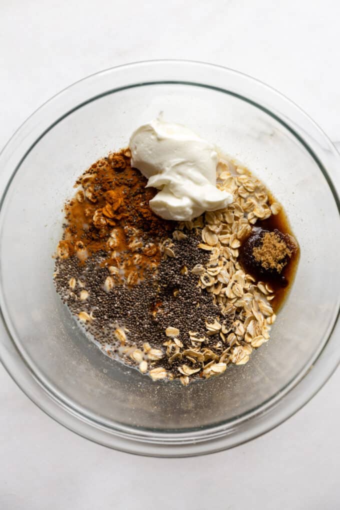 oats, cinnamon, brown sugar, chia seeds and yogurt in a bowl