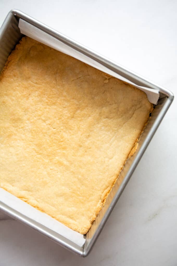 baked almond flour crust in an 8x8 inch pan