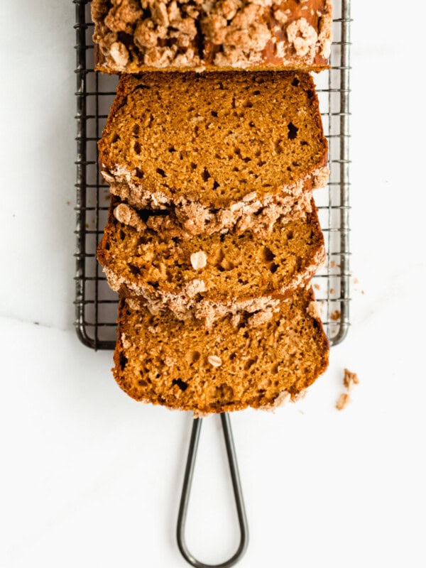 Pumpkin banana bread sliced on a cooling rack