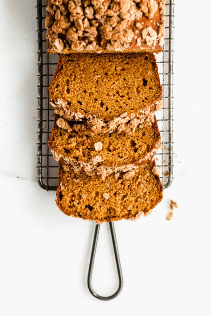 Pumpkin banana bread sliced on a cooling rack