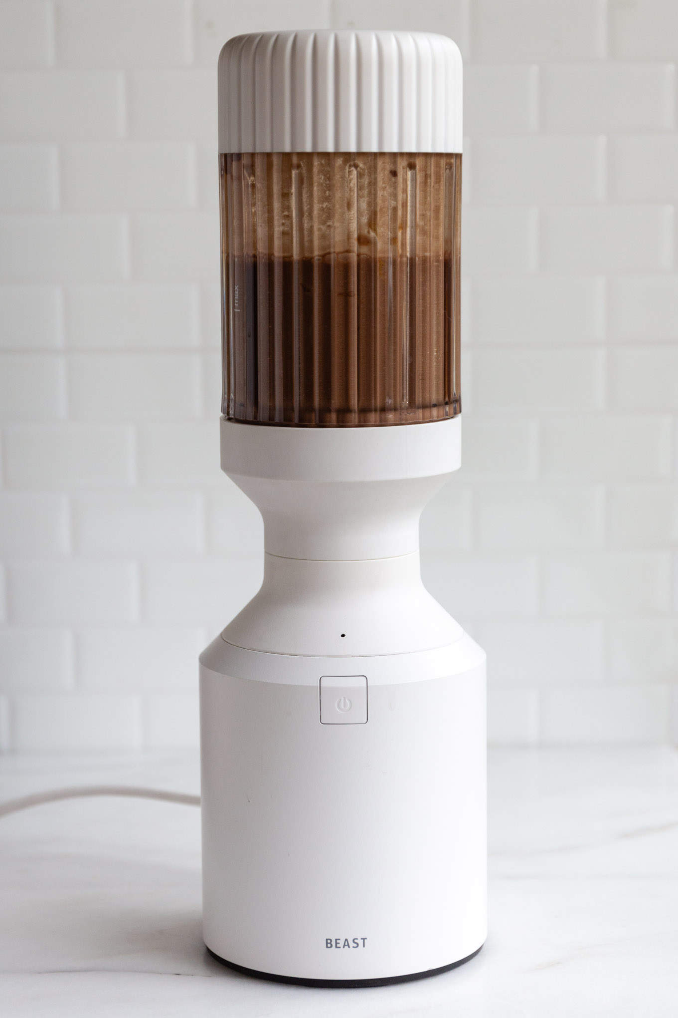 a blender with chocolate banana smoothie in it