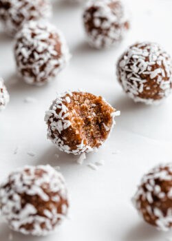 a pecan pie energy ball with a bite taken out of it