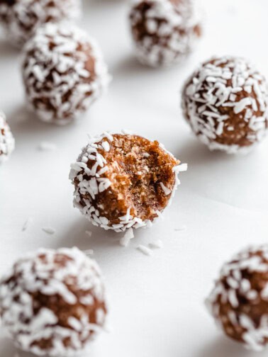 a pecan pie energy ball with a bite taken out of it