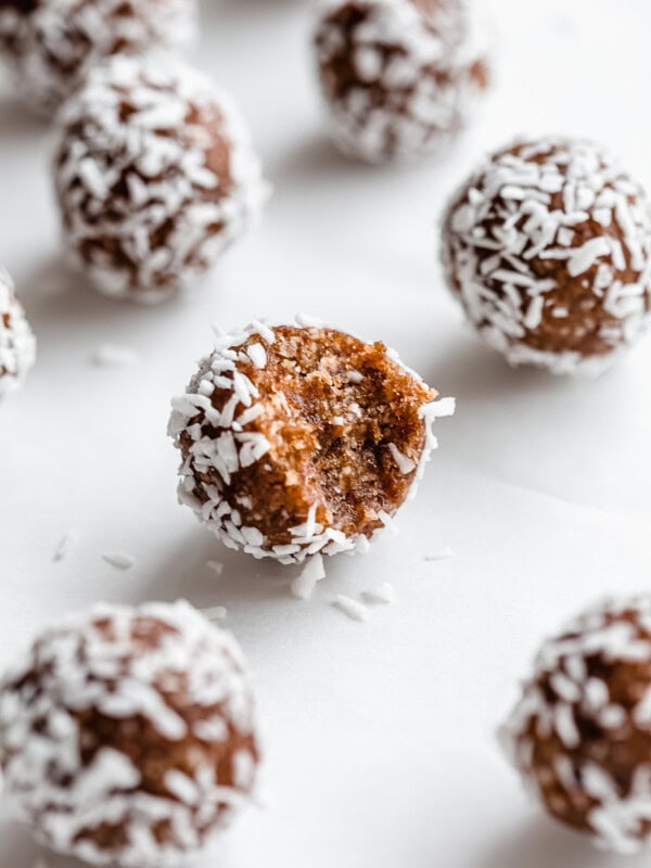 a pecan pie energy ball with a bite taken out of it