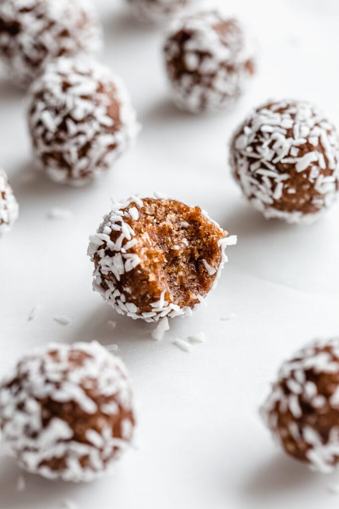 a pecan pie energy ball with a bite taken out of it