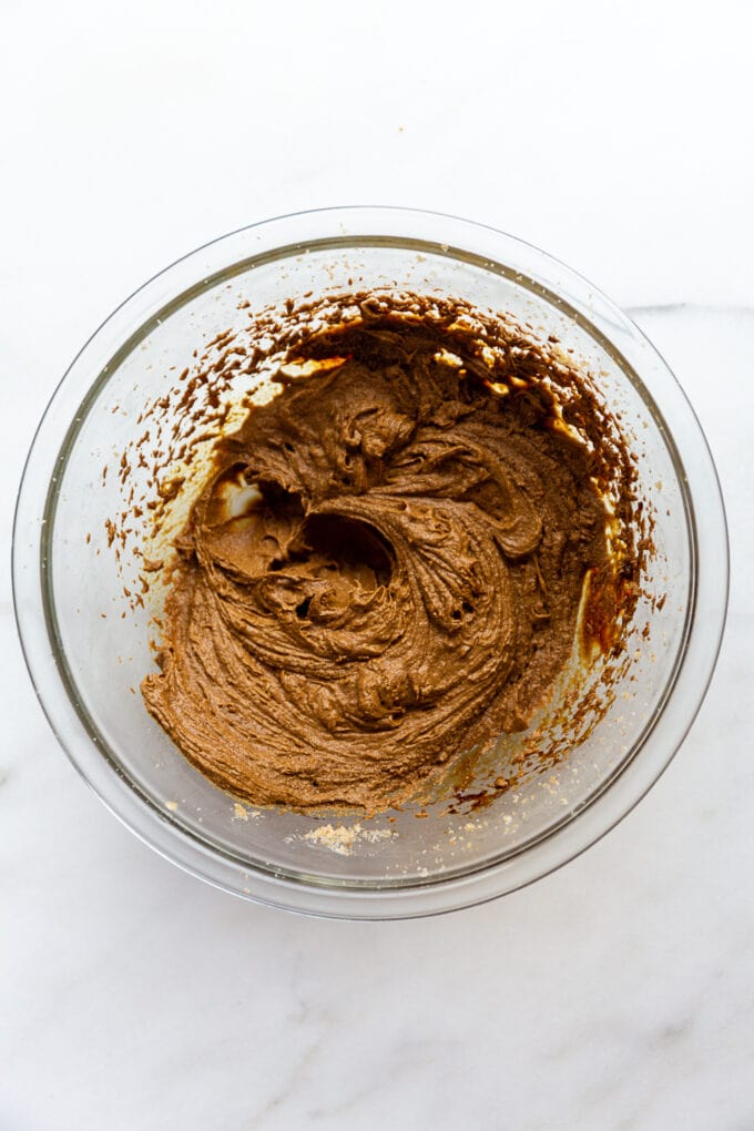 wet ingredients for ginger molasses cookies mixed together in a bowl