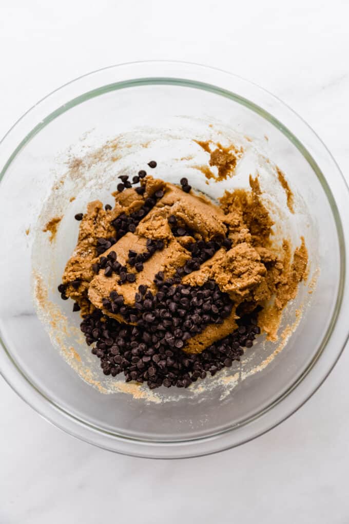 protein bar dough and chocolate chips in a mixing bowl