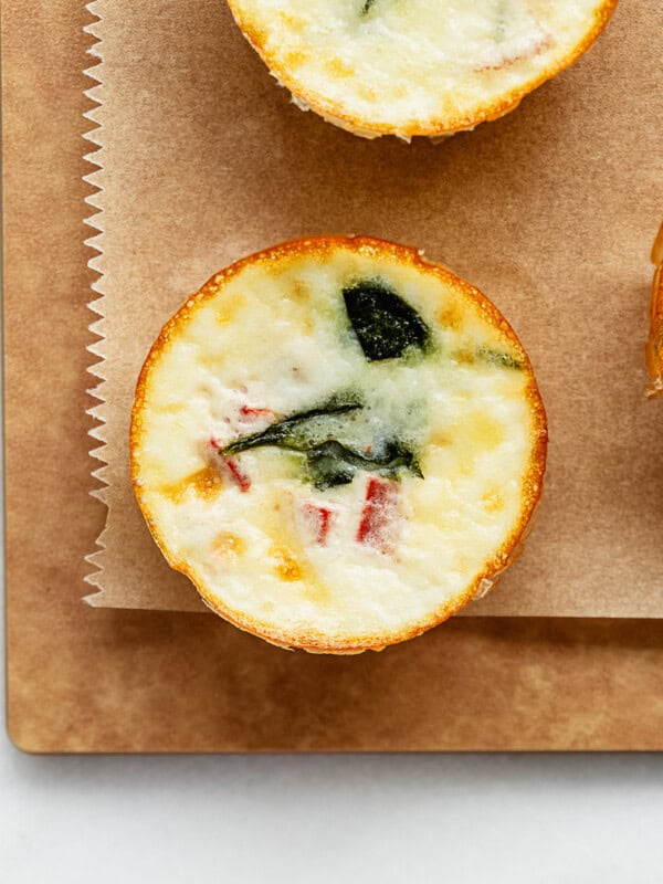 an egg white bite on a wood cutting board